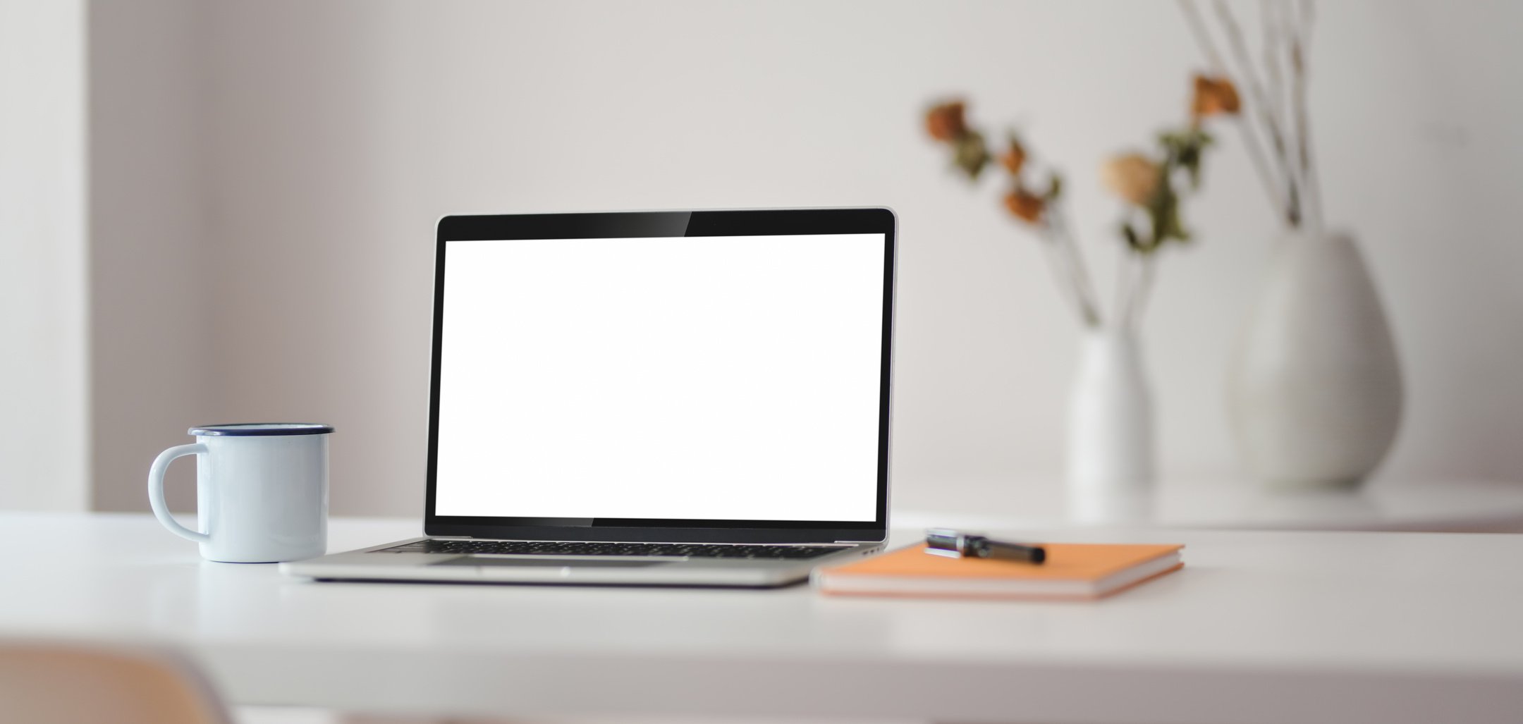 Black and Silver Laptop Computer on White Table